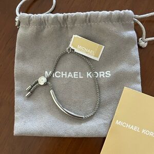 Michael Kors Silver Bar Bracelet w/ gray colored rope w/sliding silver hardware.